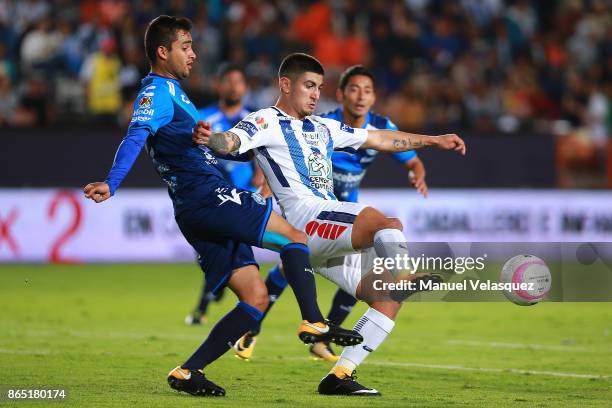 Alonso Zamora of Puebla figths for the ball with Victor Guzman of Pachuca during the 14th round match between Pachuca and Puebla as part of the...