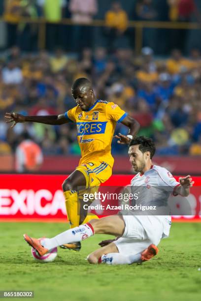 Enner Valencia of Tigres fights for the ball with Santiago Garcia of Toluca during the 14th round match between Tigres UANL and Toluca as part of the...