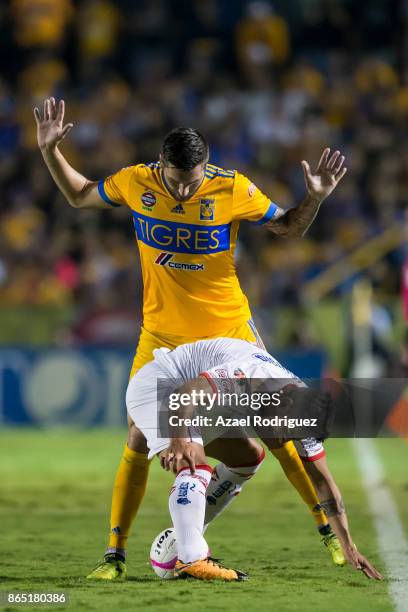 Andre-Pierre Gignac of Tigres fights for the ball with Ernesto Vega of Toluca during the 14th round match between Tigres UANL and Toluca as part of...