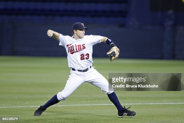 Brendan Harris of the Minnesota Twins throws to first against the Tampa Bay Rays on April 29, 2009 at the Metrodome in Minneapolis, Minnesota. The...
