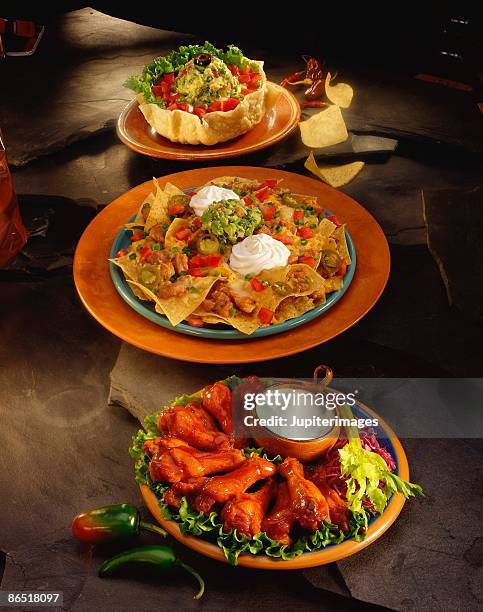 nachos with buffalo chicken wings and tostadas - buffalo chicken lettuce stock pictures, royalty-free photos & images