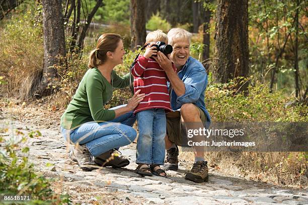 grandparents and grandson with camera - lake chelan stock pictures, royalty-free photos & images