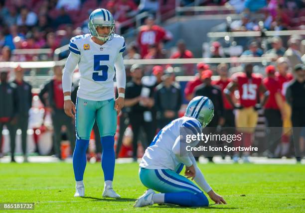 Dallas Cowboys kicker Dan Bailey gets set up to kick a extra point during the regular season game between the San Francisco 49ers and the Dallas...