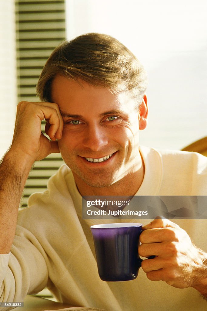 Man with cup of coffee