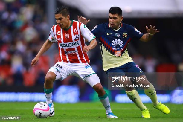 Luis Perez of Necaxa struggles for the ball with Silvio Romero of America during the 14th round match between America and Necaxa as part of the...
