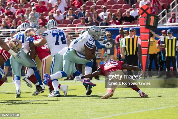 Dallas Cowboys running back Ezekiel Elliott is tackled by San Francisco 49ers free safety Jimmie Ward during the first half of the regular season...