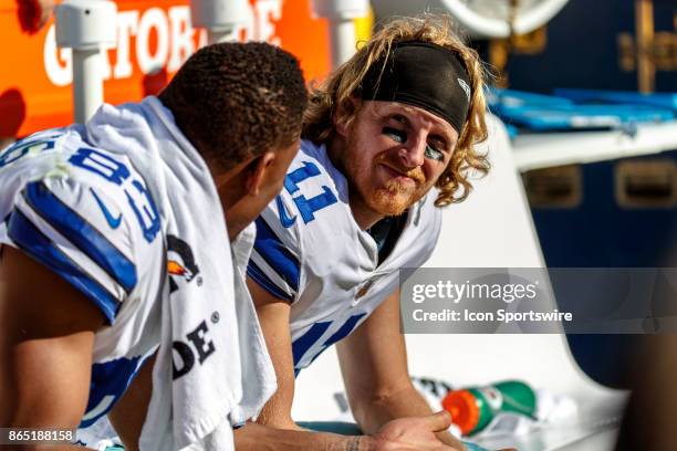 Dallas Cowboys wide receiver Cole Beasley and wide receiver Terrance Williams on the bench while the Dallas Cowboys defense works during the second...