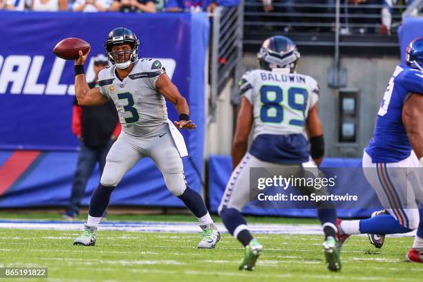 Seattle Seahawks quarterback Russell Wilson throws the ball to Seattle Seahawks wide receiver Doug Baldwin during the National Football League game...
