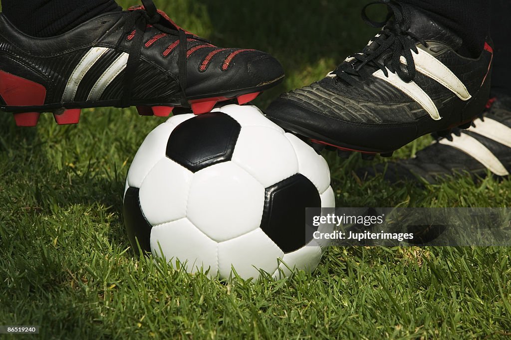 Soccer cleats on soccer ball