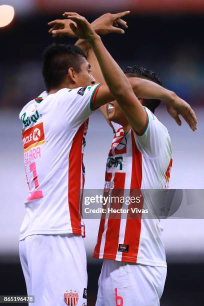 Luis Perez and Jesus Isijara of Necaxa celebrate after winning the 14th round match between America and Necaxa as part of the Torneo Apertura 2017...