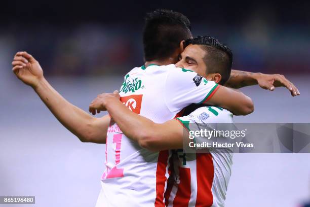 Luis Perez and Jesus Isijara of Necaxa celebrate after winning the 14th round match between America and Necaxa as part of the Torneo Apertura 2017...