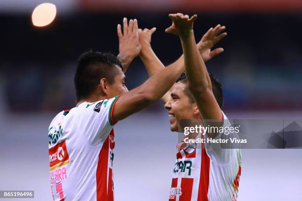 Luis Perez and Jesus Isijara of Necaxa celebrate after winning the 14th round match between America and Necaxa as part of the Torneo Apertura 2017...