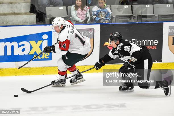 Jared McIsaac of the Halifax Mooseheads and Alex Barre-Boulet of the Blainville-Boisbriand Armada skate after the puck during the QMJHL game at...