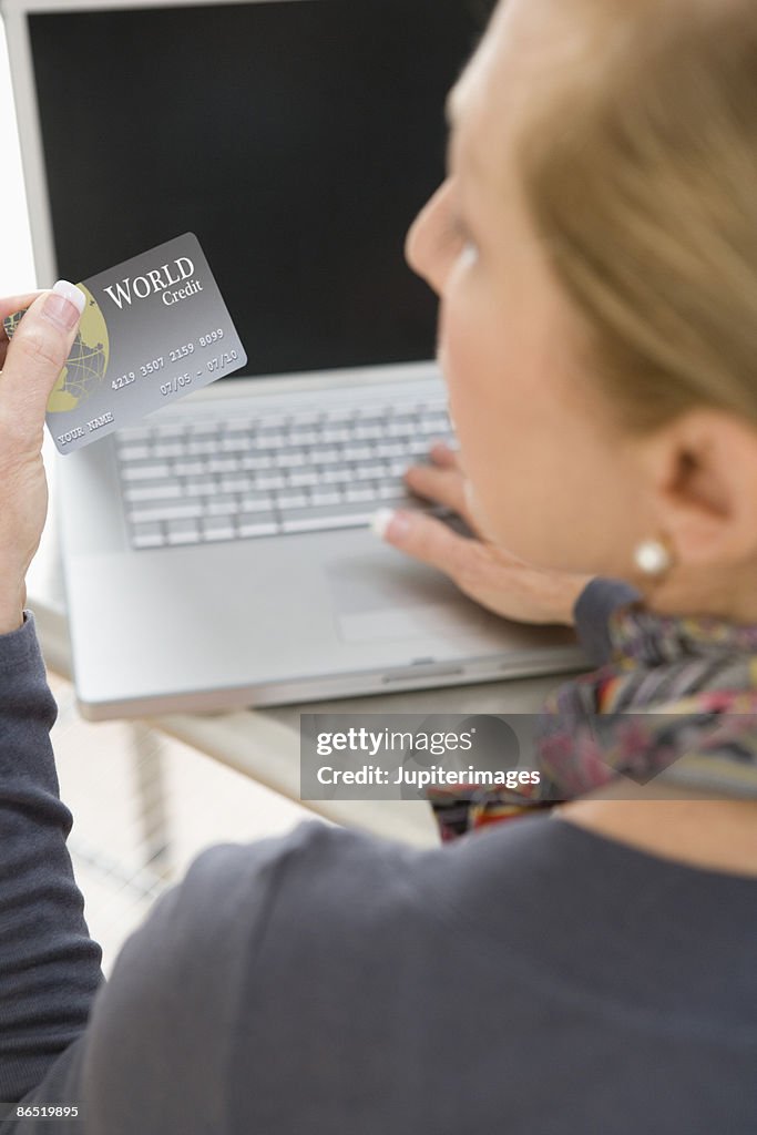 Woman holding credit card