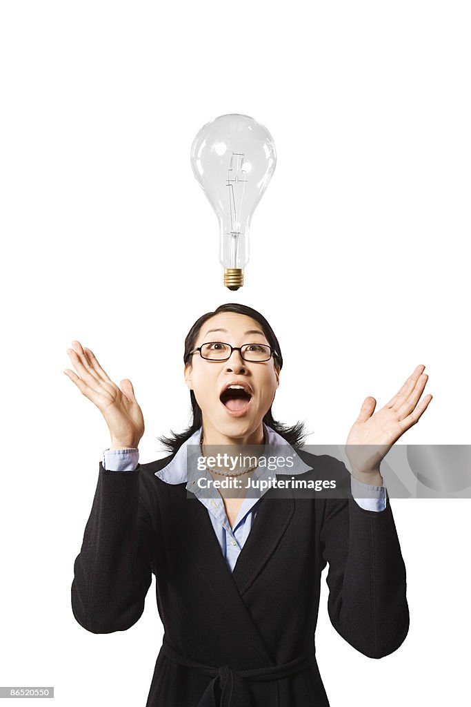 Excited woman with light bulb