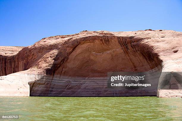 eroded rock walls at lake powell - waterline stock pictures, royalty-free photos & images