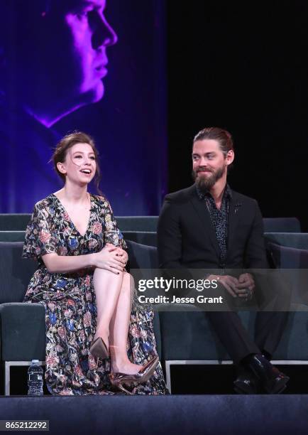 Katelyn Nacon and Tom Payne speak onstage at The Walking Dead 100th Episode Premiere and Party on October 22, 2017 in Los Angeles, California.