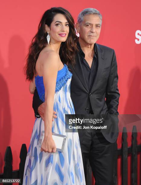 Director George Clooney and wife Amal Clooney arrive at the Los Angeles Premiere "Suburbicon" at Regency Village Theatre on October 22, 2017 in...