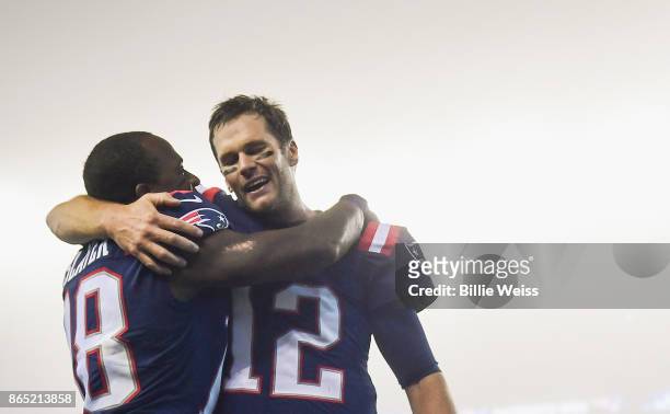 Tom Brady of the New England Patriots reacts with Matthew Slater after a game against the Atlanta Falcons at Gillette Stadium on October 22, 2017 in...