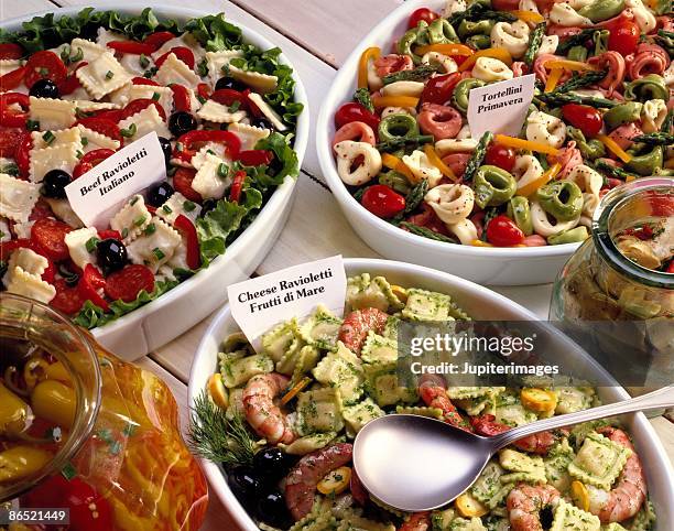 three pasta salads in deli - tortellini bildbanksfoton och bilder