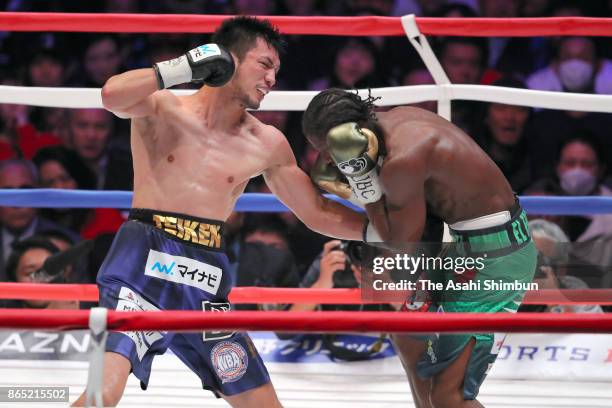 Challenger Ryota Murata of Japan connects his left on champion Hassan N'Dam of France in the 5th round during their WBA Middleweight Title Bout at...