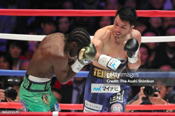 Challenger Ryota Murata of Japan connects his right on champion Hassan N'Dam of France in the 1st round during their WBA Middleweight Title Bout at...