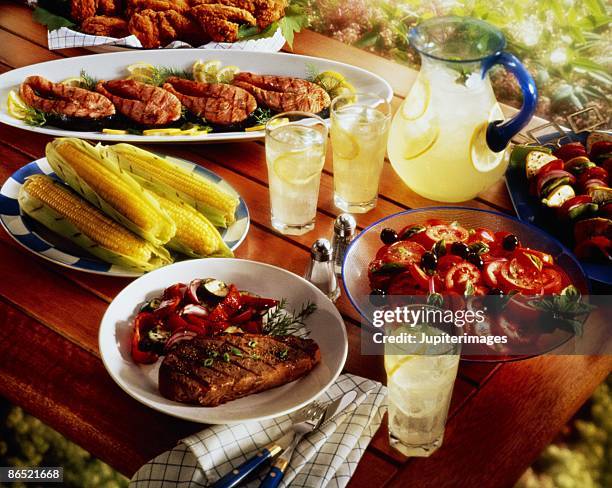 barbecue spread on picnic table - shish kebab stock pictures, royalty-free photos & images