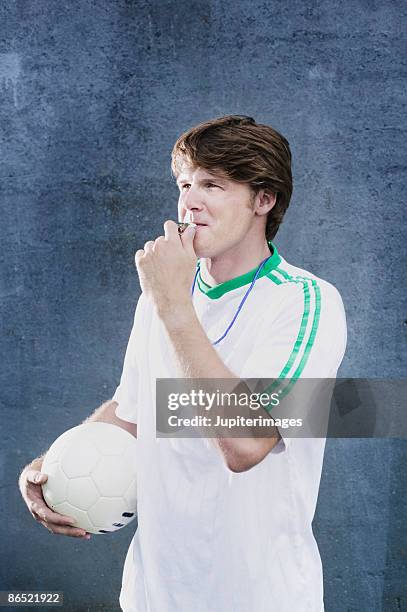 man holding volleyball - schiedsrichter pfeife stock-fotos und bilder