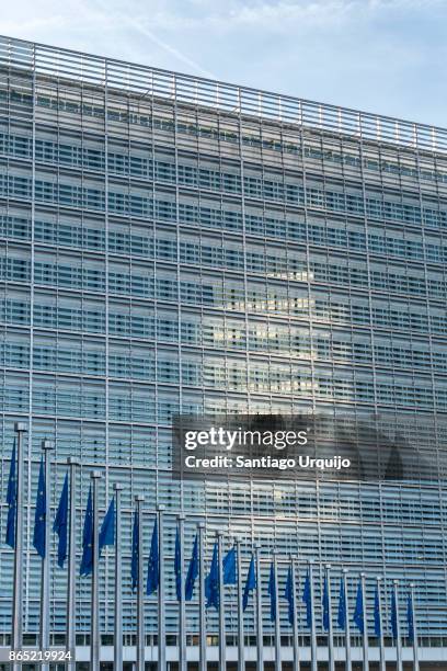european union flags at berlaymont building of the european commission - european union symbol stock pictures, royalty-free photos & images
