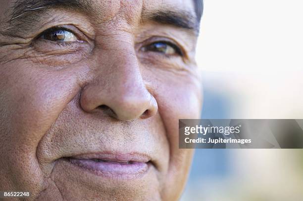 portrait of man smiling - smiling mature eyes stockfoto's en -beelden