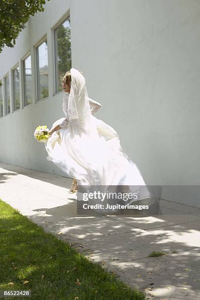 runaway bride - bride running stock-fotos und bilder