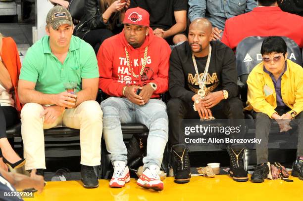 Boxer Floyd Mayweather, Jr. And James McNair , CEO TMT Music Group, attend a basketball game between the Los Angeles Lakers and the New Orleans...