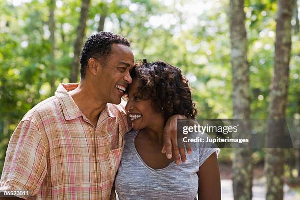 affectionate couple in woods - 45 outdoors stock pictures, royalty-free photos & images