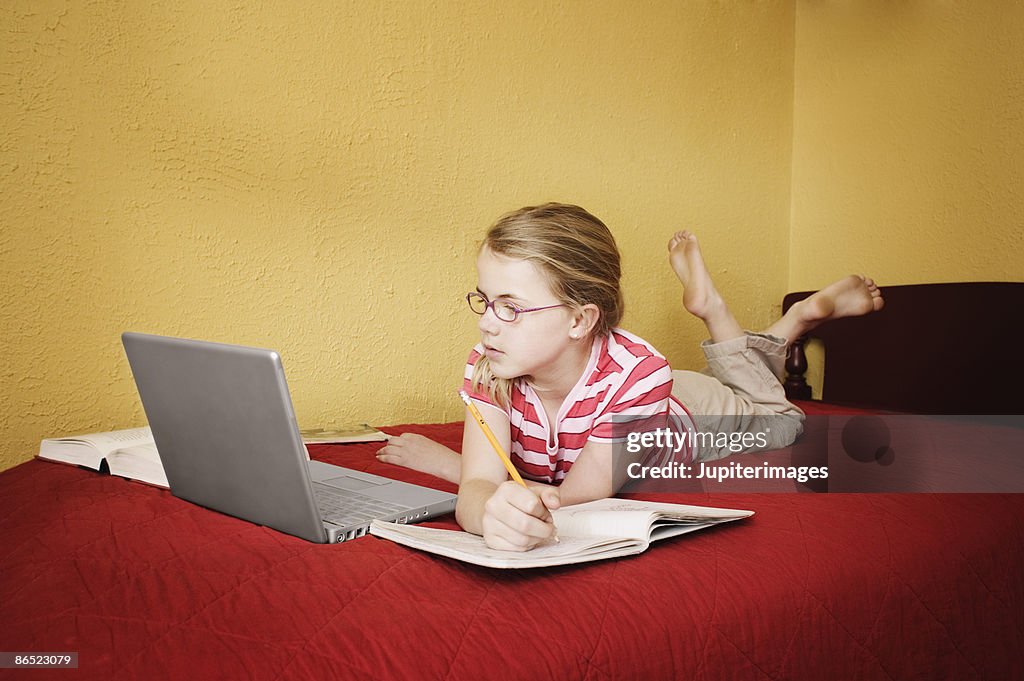 Girl working on laptop computer