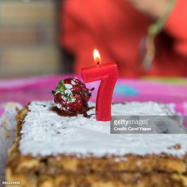 cake with number seven candle - 7th birthday stock pictures, royalty-free photos & images