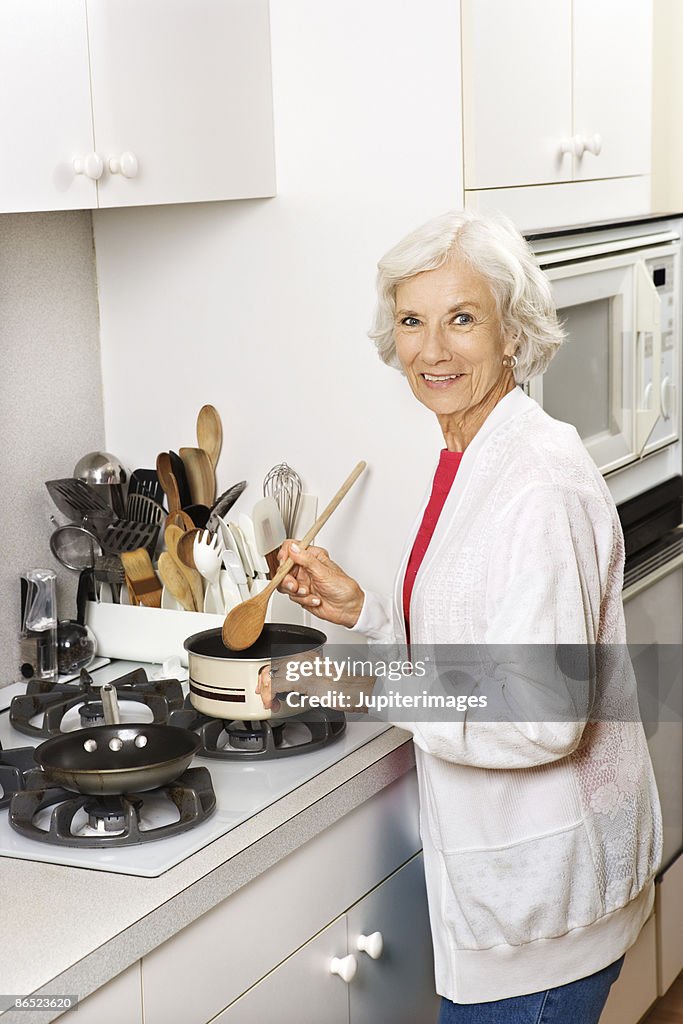 Elderly woman cooking