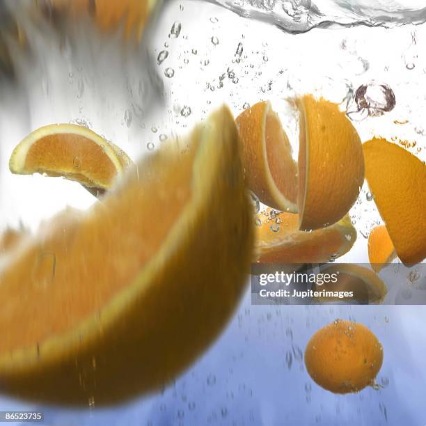 oranges in water - ネーブルオレンジ ストックフォトと画像