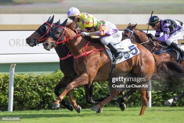 Jockey Neil Callan riding Let's Take It Easy wins Race 5 A. Lange & Sohne Excellent Handicap at Sha Tin racecourse on October 22, 2017 in Hong Kong,...