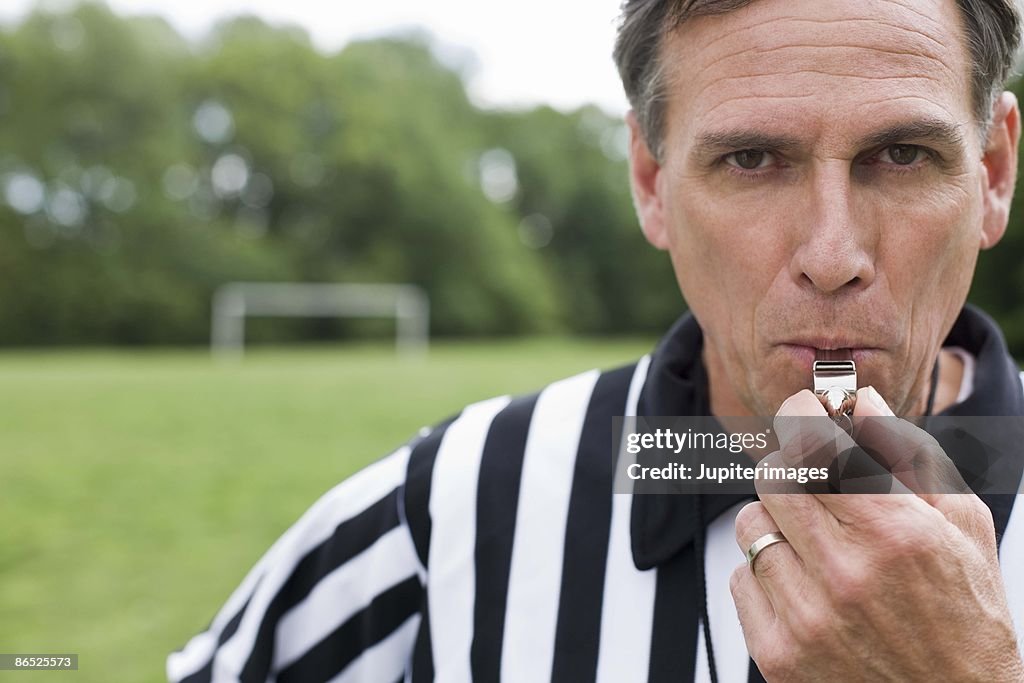 Referee with whistle