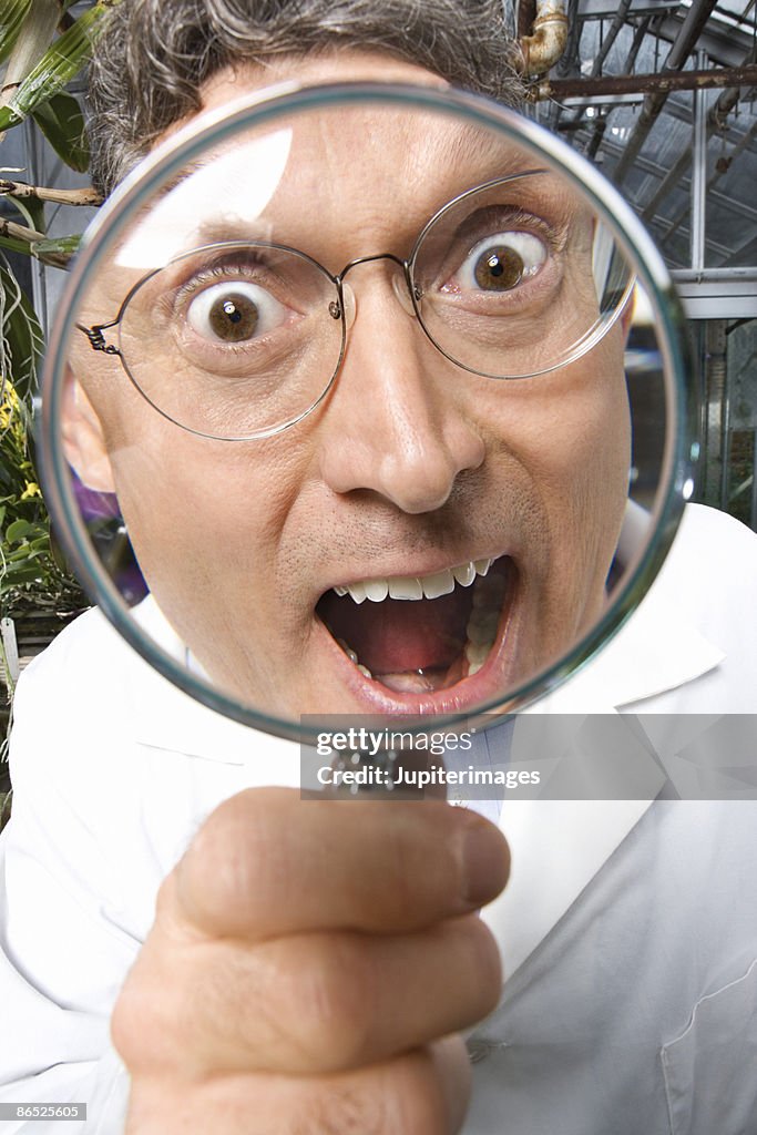 Scientist with magnifying glass