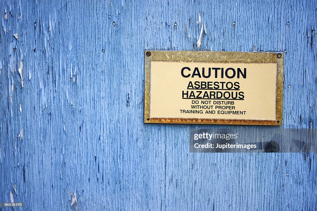 Caution sign warning of asbestos hazard