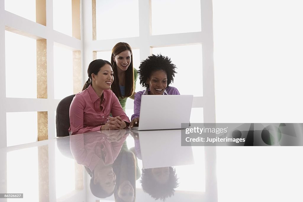 Businesswomen working on laptop