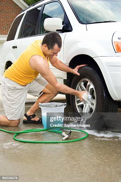 Man Cleaning Rims 62 Cleaning Rims Car Stock Photos, High-Res Pictures, and Images ...