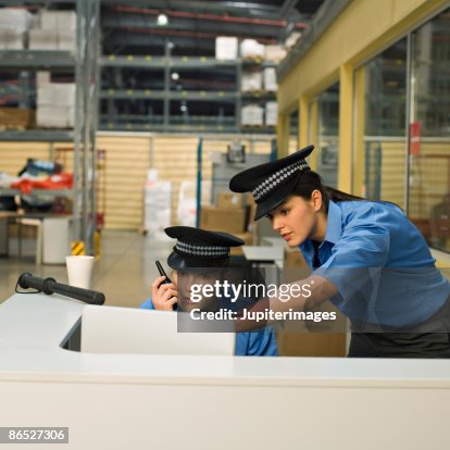 Security guards at security checkpoint Security guards at security checkpoint