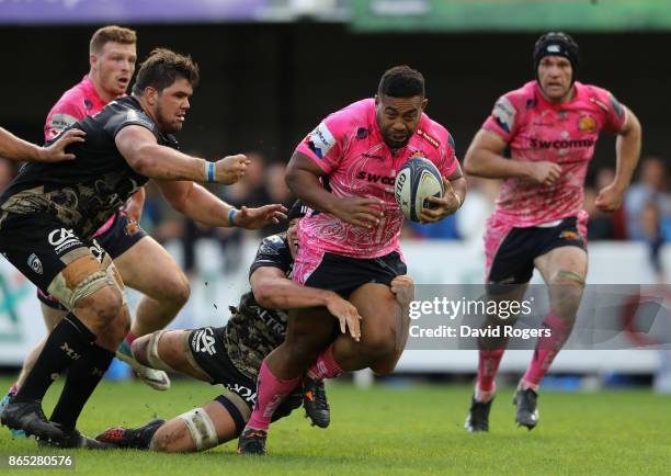 Elvis Taione of Exeter Chiefs is held during the European Rugby Champions Cup match between Montpellier and Exeter Chiefs at Altrad Stadium on...