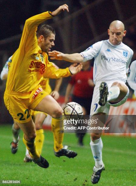 Nantes's defender Sylvain Armand vies with Auxerre's midfielder Gilles Pantxi Sirieix during their French L1 soccer match, 20 December 2003 in...