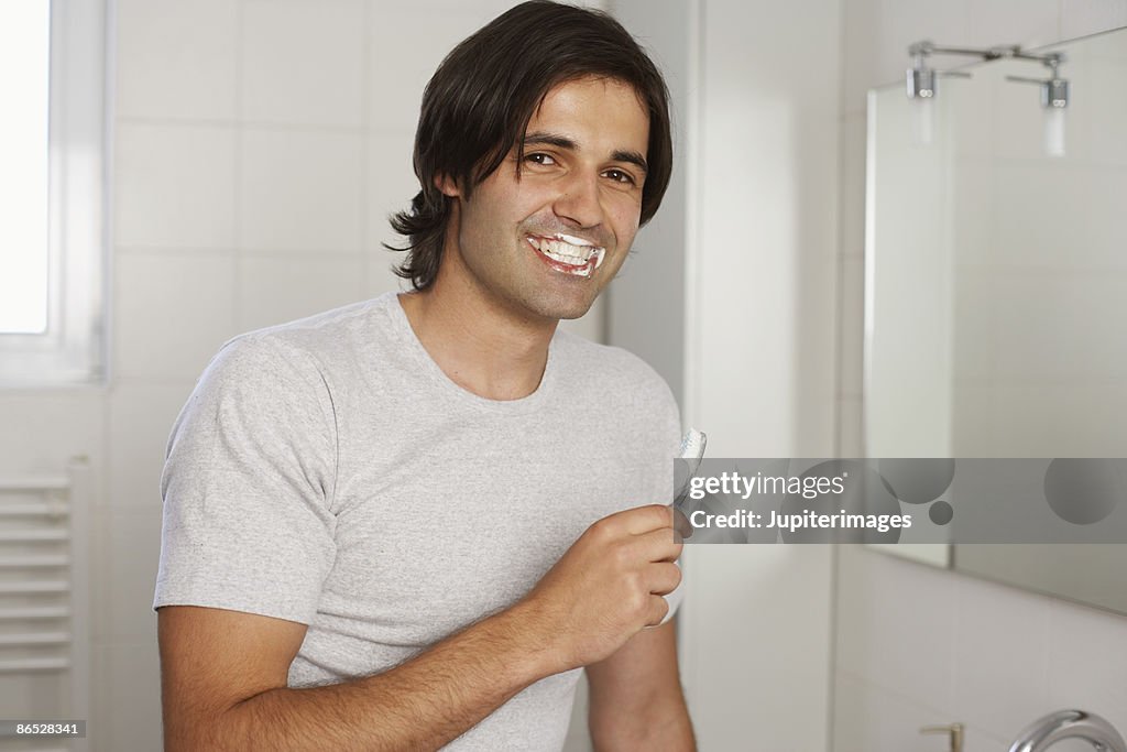 Man brushing teeth