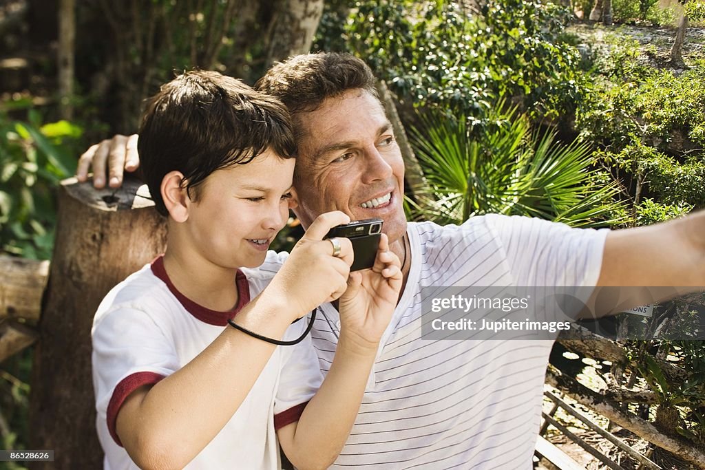 Father and son with binoculars