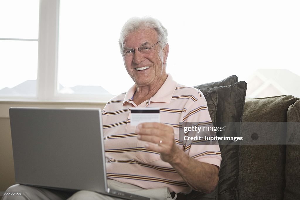 Man with laptop and credit card