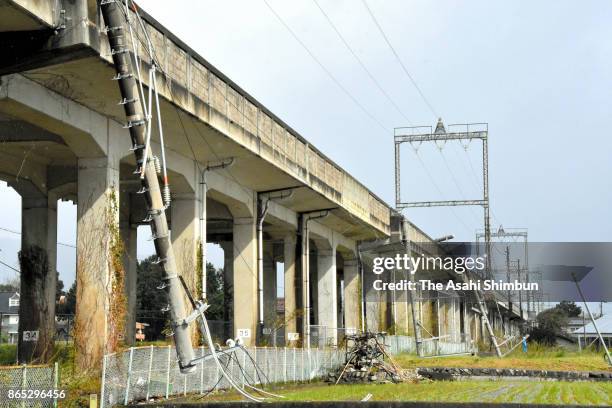 An electric pole of JR Kosai Line falls after powerful Typhoon Lan hit past Japan's mainland on October 23, 2017 in Otsu, Shiga, Japan. Powerful...